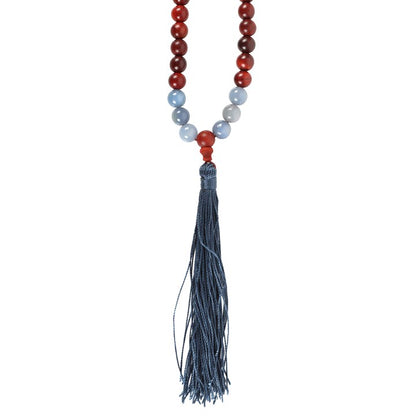 Stunning rosewood and sodalite mallah necklace with a blue tassel, perfect for Reiki healing necklaces and spiritual practices.