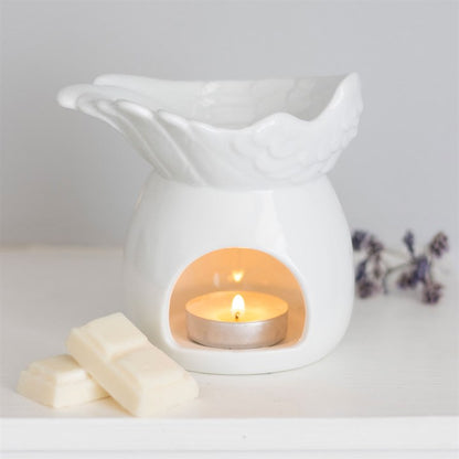 Elegant Angel Wing Dish oil burner in white ceramic with a tealight candle, perfect for fragrance and ambiance