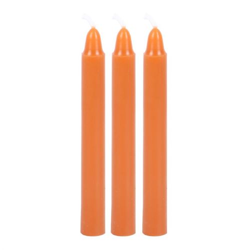 Three orange candles from the Attraction Spell Candle Kit to enhance your spiritual toolkit