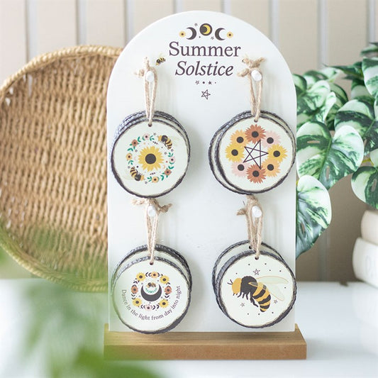 Set of 16 Summer Solstice decorations featuring floral designs and motifs displayed on a stand for seasonal celebration.