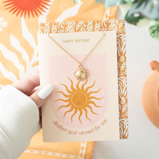 Sun Necklace displayed on a cheerful birthday card featuring a sun design, perfect for gifting from Kimchi Toki