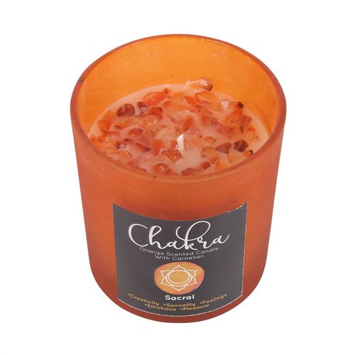 Sacral Chakra orange candle with crystal chips, promoting creativity and passion, perfect for a calming ambiance.