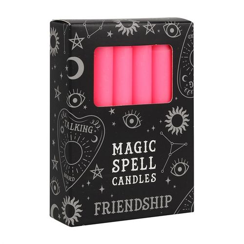 Set of 12 pink friendship candles in a black box with mystical designs, perfect for spell work and rituals.