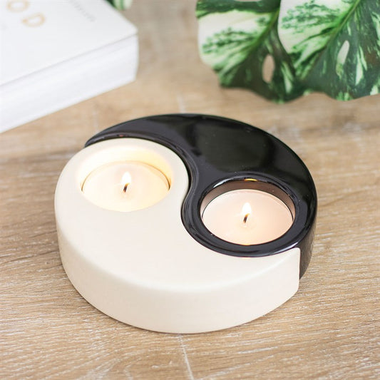 Elegant Yin Yang tea light holder in black and cream, perfect for adding a calming atmosphere to any space