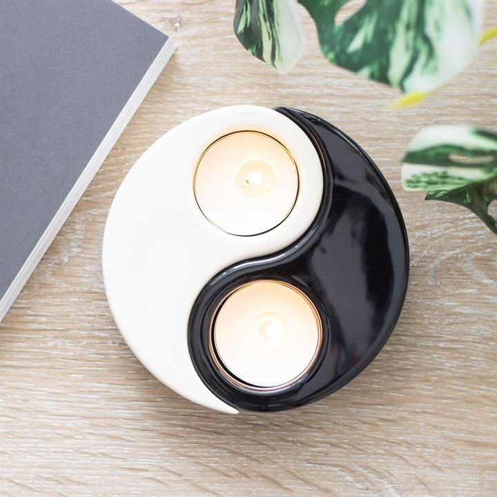 Elegant Yin Yang tea light holder featuring a sleek black and white design, perfect for adding a calming touch to any space
