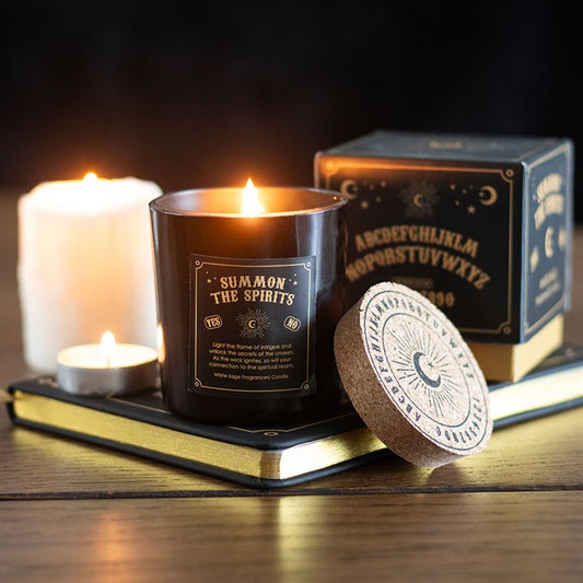 Summon the Spirits Talking Board Aromatherapy white sage candle in a black jar with a natural cork lid