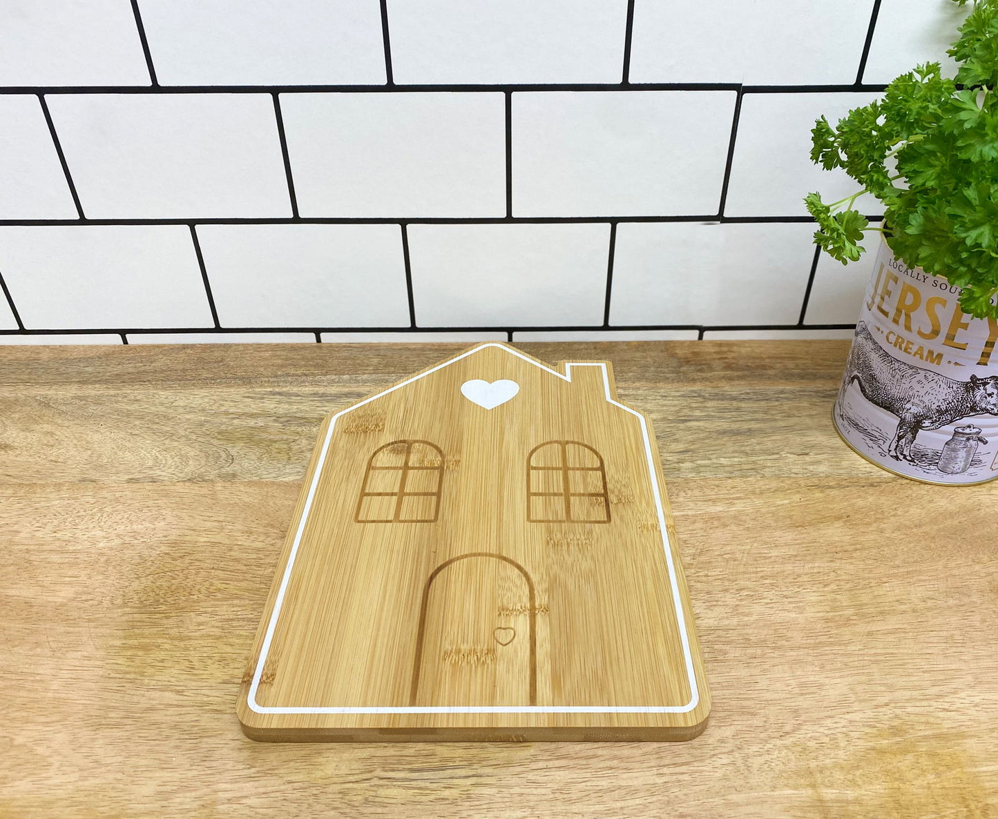 Geko Products bamboo house serving tray with engraved windows and door on wooden countertop
