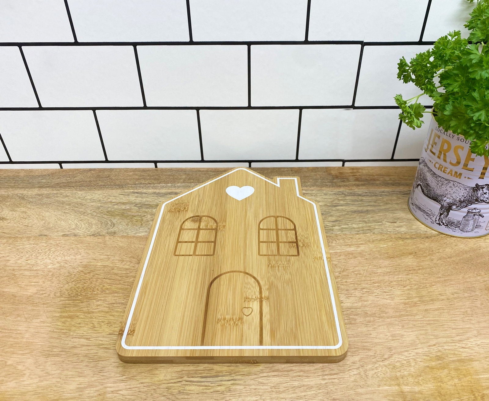 Geko Products bamboo house serving tray with engraved windows and door on wooden countertop