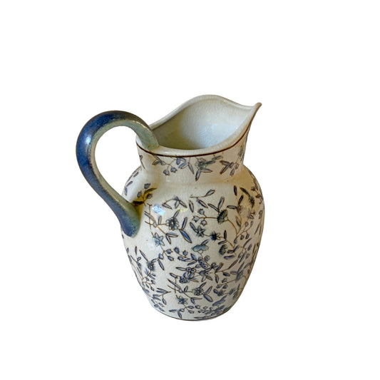 Blue and white decorative jug with floral patterns and a curved handle by Geko Products