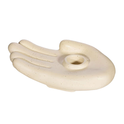 Beige ceramic hand-shaped candle holder with smooth finish and small candle cup in palm
