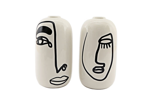 Set of ceramic vases with face design featuring abstract black line art on white vases by Geko Products