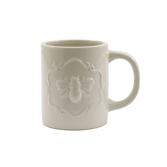 Cream ceramic bee mug with embossed bee design and comfortable handle by Geko Products