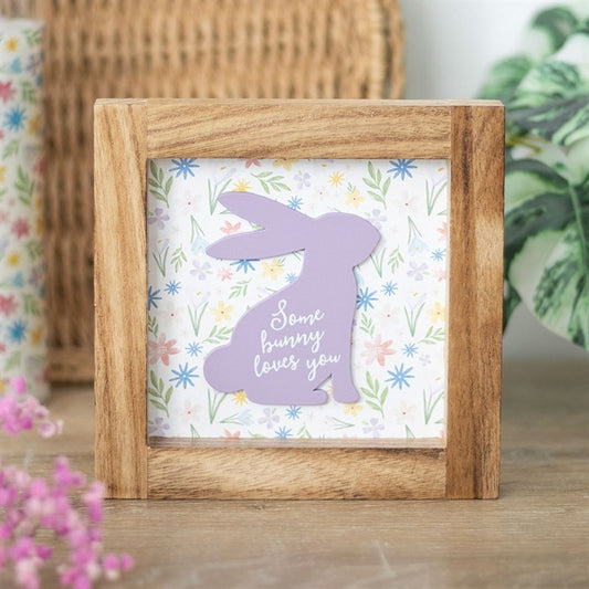 Cute bunny frame decor featuring a wooden frame with a pastel bunny design and floral background
