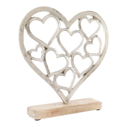 Decorative silver heart sculpture with multiple interconnected hearts on wooden base