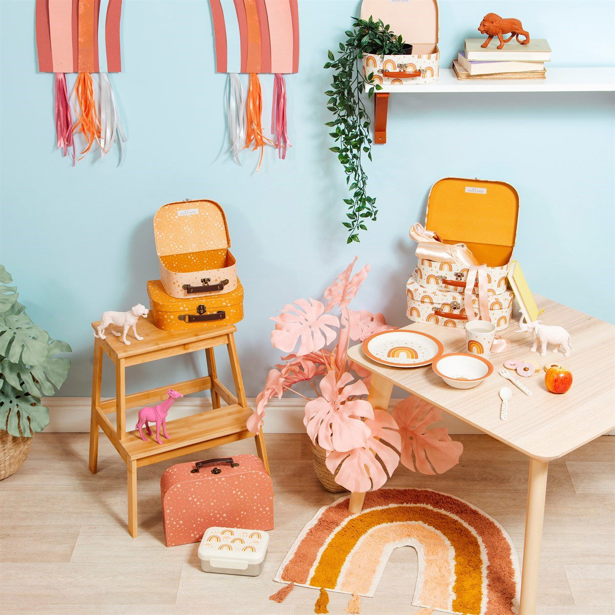 Earth rainbow rug with tassels on floor in colorful kids playroom with toys and decor
