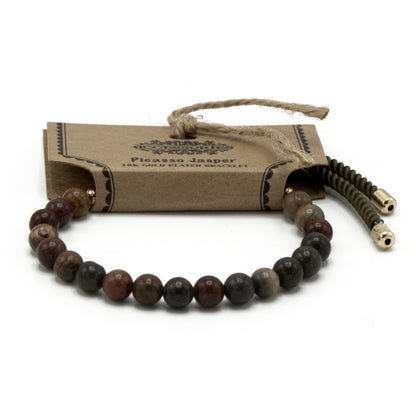 Picasso Jasper gemstone string bracelet packaged with natural elements for a stylish look