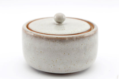 Geko Products taupe ceramic pot with lid featuring a smooth rounded design and subtle speckled texture