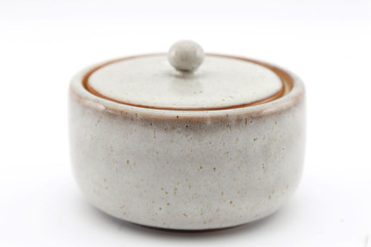 Geko Products taupe ceramic pot with lid featuring a smooth rounded design and subtle speckled texture