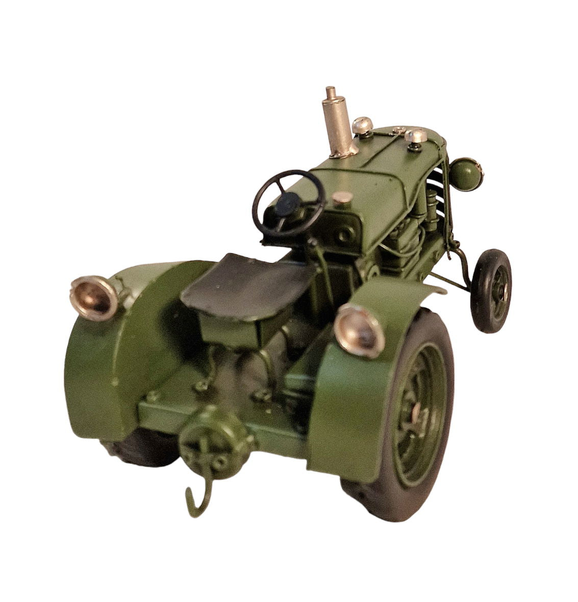Green metal tractor ornament with detailed vintage design and black steering wheel