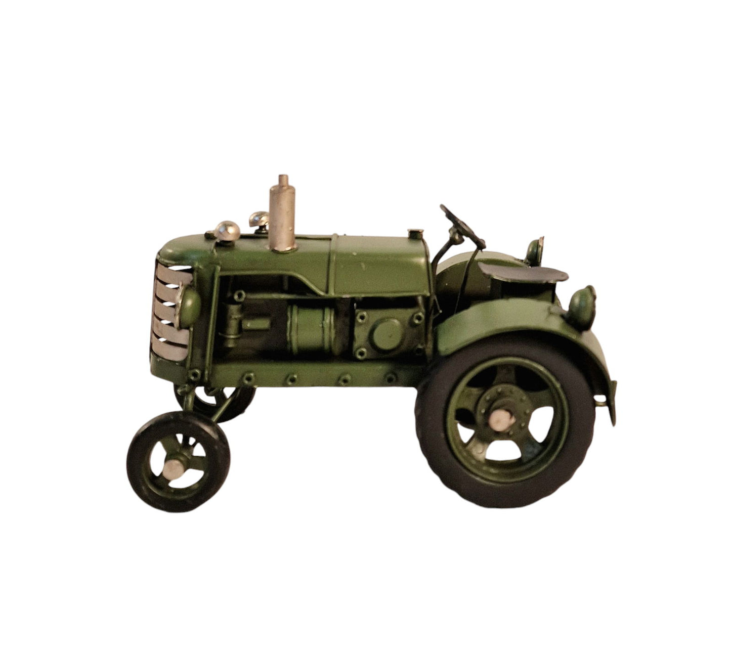 Green metal tractor ornament with detailed vintage design and large rear wheels