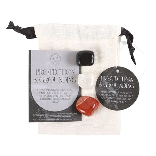 Grounding and protection crystal set with four selected crystals in a pouch for energy field protection.