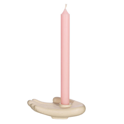Geko Products beige hand-shaped candle holder with a tall pink taper candle