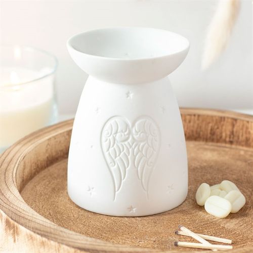 White ceramic angel wings oil burner with detailed wing design for home fragrance