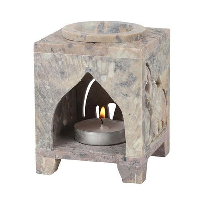 Carved Elephant Oil Burner made from soapstone with intricate designs and a candle holder