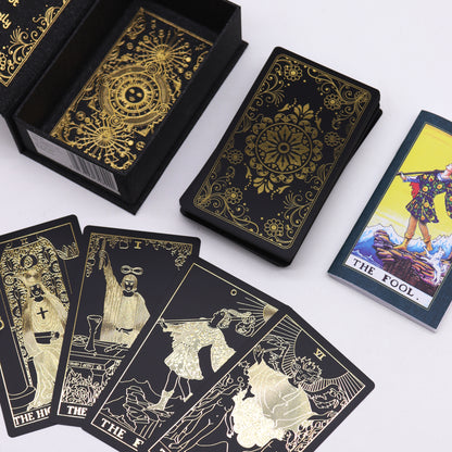 Luxury tarot card set featuring gold foil designs and a guidebook, ideal for spiritual practices