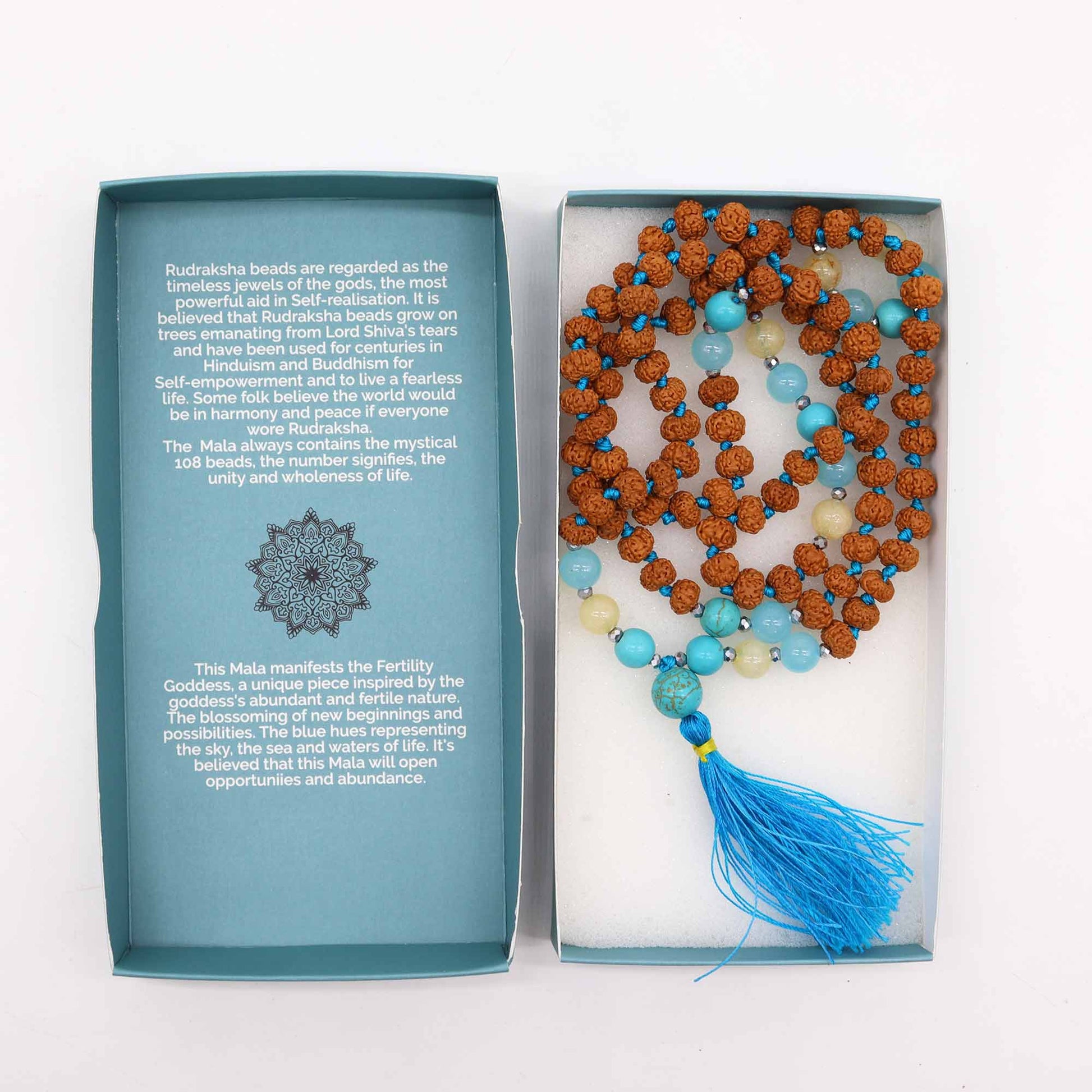 Mala necklace for fertility with Rudraksha beads and a blue tassel, symbolizing abundance and healing.