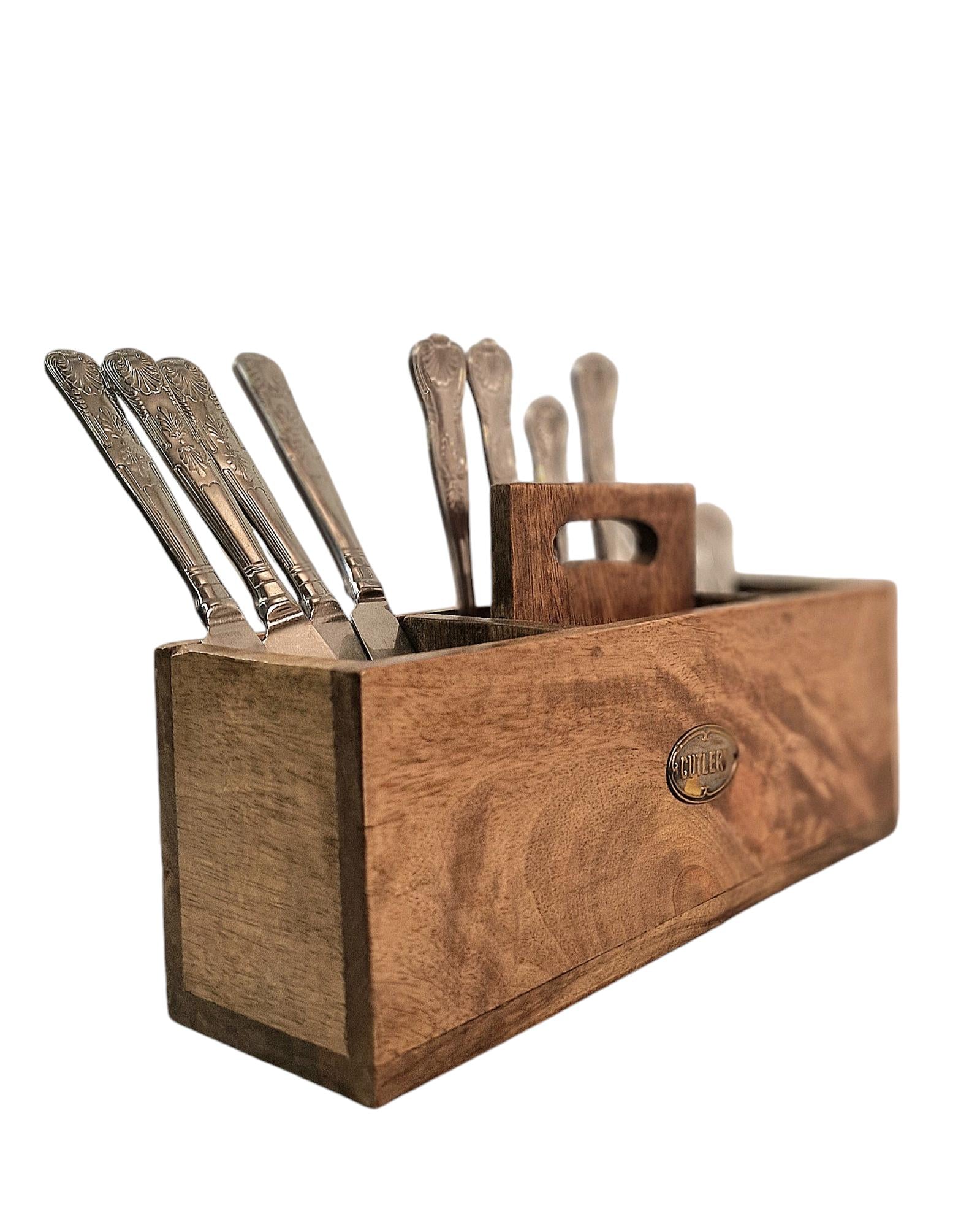 Geko Products mango wood cutlery stand holding various silver cutlery pieces with a natural wooden finish