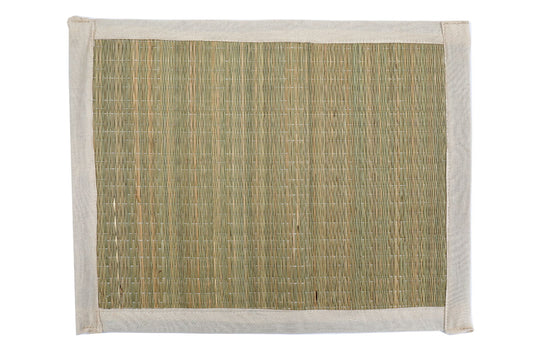 Woven grass place mats set with natural fibers and beige fabric border