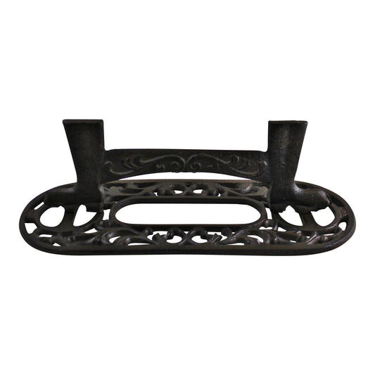 Ornate cast iron boot scraper with decorative scrollwork design and sturdy construction