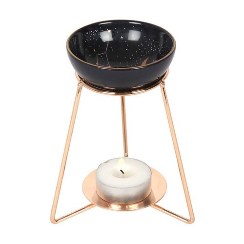 Purple star sign oil burner on a stylish metal base, perfect for aromatherapy and home decor