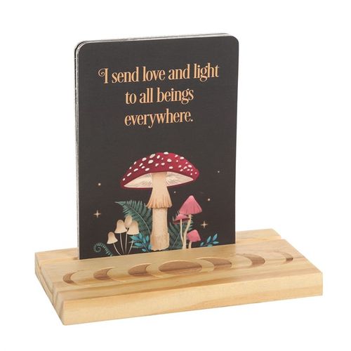 Reiki affirmation cards featuring a mushroom design with a positive message on a wooden stand