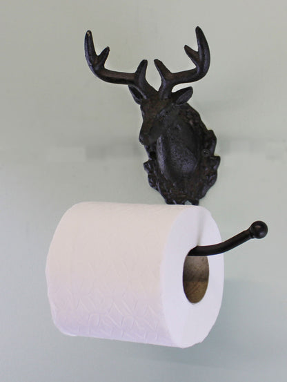 Rustic stag head toilet roll holder in dark metal mounted on wall with white toilet paper roll