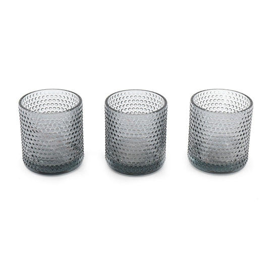 Set of three textured gray glass spiritual tea light holders by Geko Products on white background