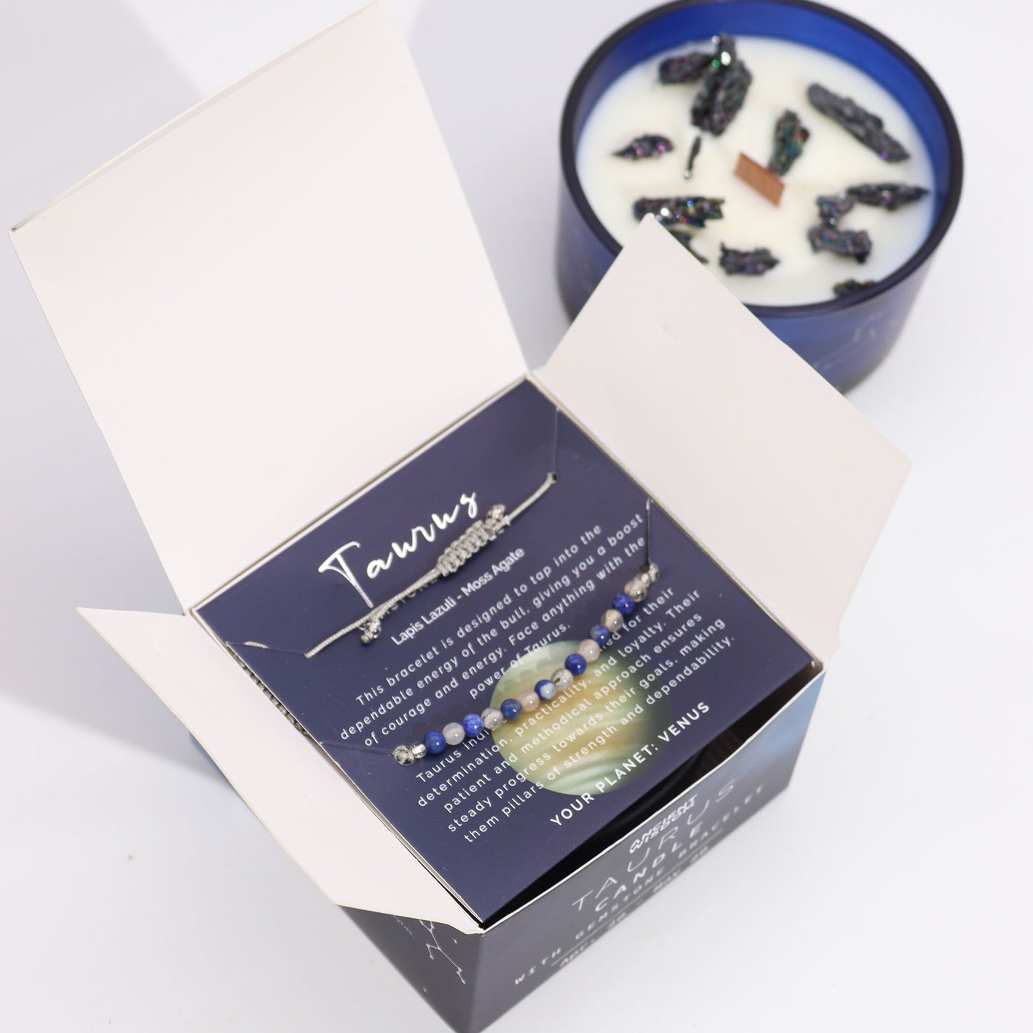 Taurus bracelet in a box beside a candle from Zodiac Crystal Candle with Gemstone Bracelet