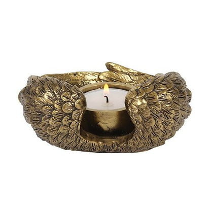 Antique gold angel wing candle holder beautifully crafted with intricate detailing, perfect for adding elegance to any tealight candle decor.