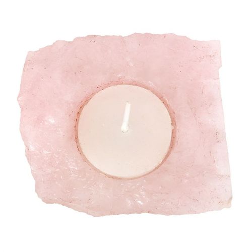 Rose quartz tealight holder featuring a natural, rough-cut design with a white candle placed inside for ambiance.