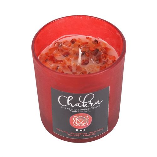 Root chakra strawberry crystal candle featuring vibrant red color and chip crystals for grounding and stability.
