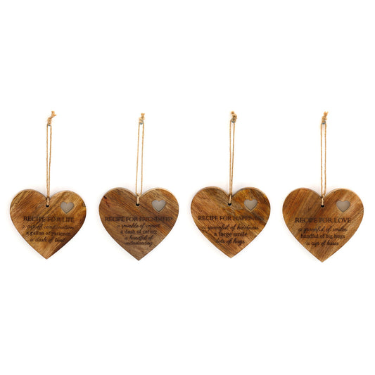 Set of four wooden heart-shaped wall hangings with spiritual life recipe decor text and small heart cutouts